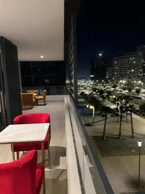 a balcony with a table and chairs and a city at Casablanca Finance City 33 Tower in Casablanca