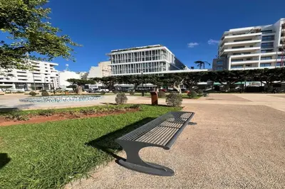 a bench in a park with buildings in the background at Apartment Studio en Cœur de Casablanca ,Racine in Casablanca