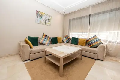 a living room with a couch and a table at Apartment Studio en Cœur de Casablanca ,Racine in Casablanca