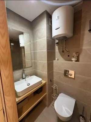 a bathroom with a white toilet and a sink at Urban flat Bourgogne in Casablanca