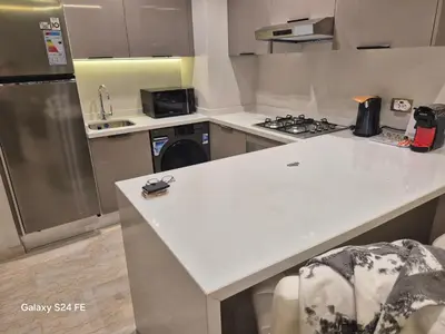 a kitchen with a white counter top and a stove at aeroperla 11 aeroprt casa blanca in Nouaseur