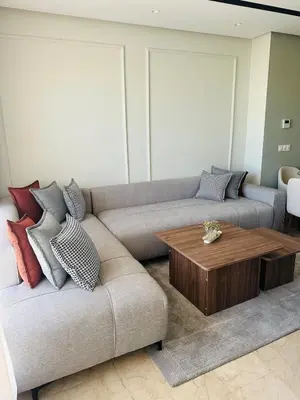 a living room with a couch and a coffee table at Studio Adam 18 CFC 2 minutes away in Casablanca