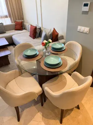 a living room with a table and chairs and a couch at Studio Al Mahdi 23 CFC 2 minutes away in Casablanca