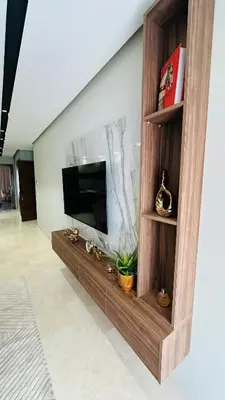 a living room with a flat screen tv on a wall at Studio Iza 08 CFC à 2mn in Casablanca