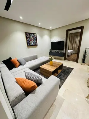 a living room with two couches and a television at Studio le César 6 CFC 2 minutes away in Casablanca