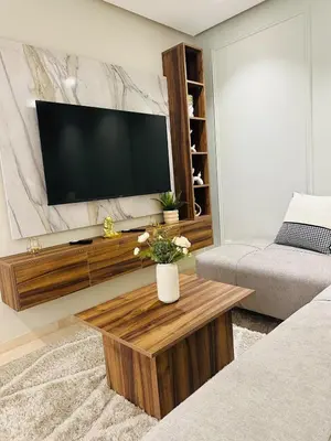 a living room with a flat screen tv on a wall at Studio New York 1 CFC 2 minutes away in Casablanca