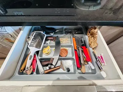 a drawer filled with lots of utensils at Melrose Sea View, Pool & Garden in Tamaris
