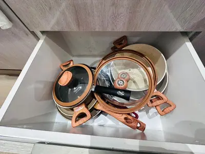 a table with a magnifying glass in a drawer at Melrose Sea View, Pool & Garden in Tamaris
