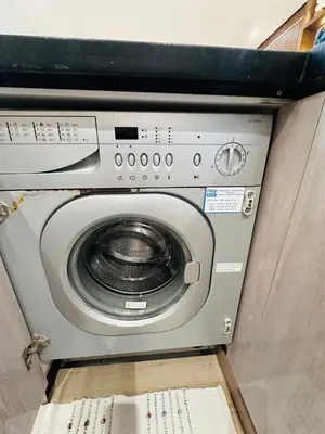 a washing machine with its door open in a vehicle at Melrose Sea View, Pool & Garden in Tamaris