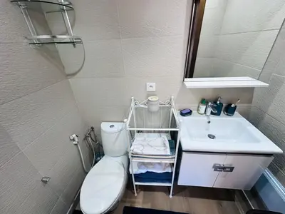 a small bathroom with a toilet and a sink at Melrose Sea View, Pool & Garden in Tamaris