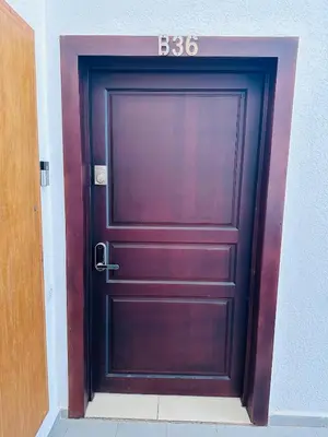 a wooden door with a sign on top of it at Melrose Sea View, Pool & Garden in Tamaris