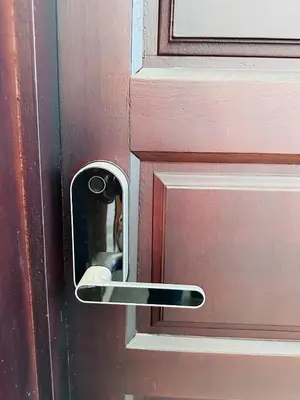 a wooden door with a metal door knob at Melrose Sea View, Pool & Garden in Tamaris
