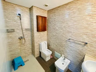 a bathroom with a toilet and a shower and a sink at Janat KLK, tamaris beach in Tamaris