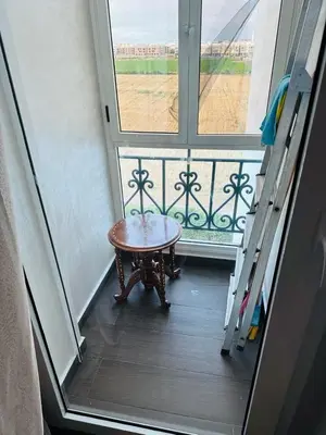 a room with a table in front of a window at Janat KLK, tamaris beach in Tamaris