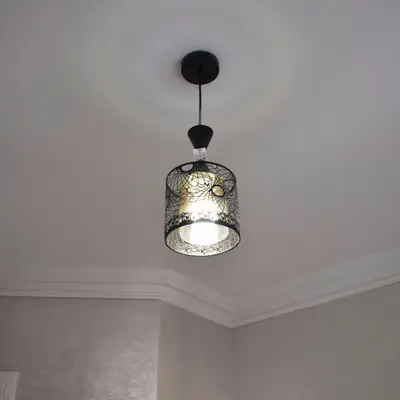 a chandelier hanging from a ceiling in a room at tanger in Aïn Diab