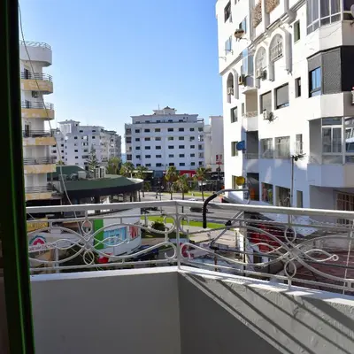 a balcony with a view of a city with buildings at tanger in Aïn Diab
