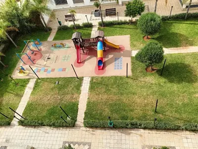 an aerial view of a park with a playground at Appart Haut Standing, Très Calm à Nouaceur, Parking, Piscine, à 4min de l'Aéroport in Casablanca