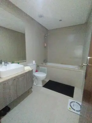 a bathroom with a toilet and a tub and a sink at Appart Haut Standing, Très Calm à Nouaceur, Parking, Piscine, à 4min de l'Aéroport in Casablanca