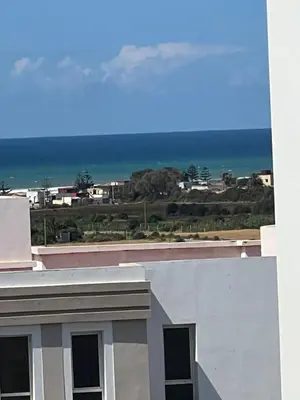 a view of the ocean from a building at Vue mer, confort, plage à 10 min in Sidi Rahal