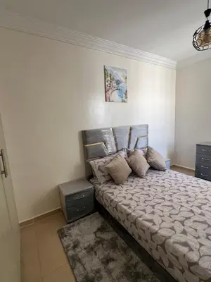 a bedroom with a bed in a room at Vue mer, confort, plage à 10 min in Sidi Rahal