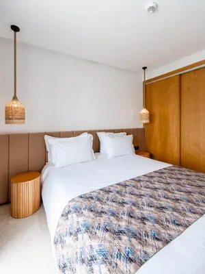 a hotel room with two beds and two lamps at Spinoza House Suite de luxe Casablanca - Maarif in Casablanca