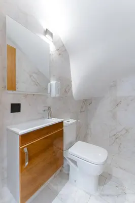 a bathroom with a toilet and a sink and a mirror at Spinoza House Suite de luxe Casablanca - Maarif in Casablanca