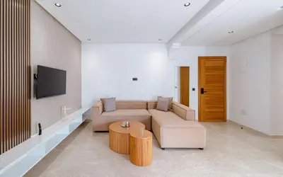 a living room with a couch and a table at Spinoza House Suite de luxe Casablanca - Maarif in Casablanca