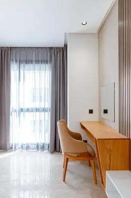a room with a desk and a chair and a window at Spinoza House Suite de luxe Casablanca - Maarif in Casablanca