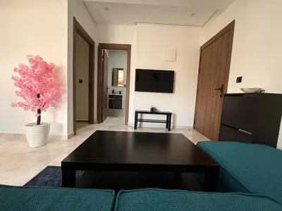 a living room with a couch and a table at Elegance & Comfort - by Nero in Casablanca