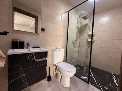 a bathroom with a toilet and a shower and a sink at Urban Loft - by Nero in Casablanca