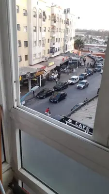 a view of a city street from a window at Chez Fatima - Nassim Gh12 in Mohammedia