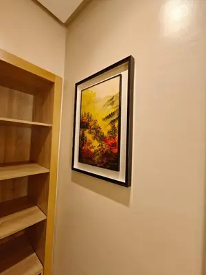 a painting hanging on a wall in a room at L'Écume Des Sablettes in Mohammedia