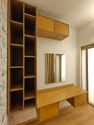a room with wooden shelves and a mirror at L'Écume Des Sablettes in Mohammedia