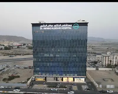 a tall building with a sign on the side of it at fermer in Casablanca