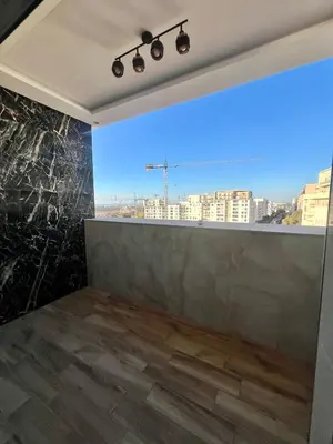 a room with a view of a city at CAN STADIUM VIEW Luxurious Place Prestigia Hay Riad in Rabat
