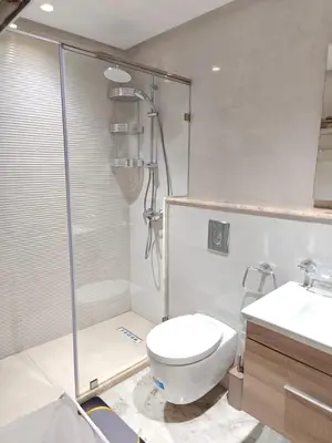 a bathroom with a shower and a toilet and a sink at L'Écume des Sablettes in Mansouria