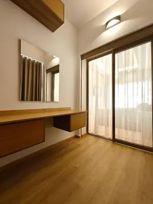 a room with a mirror and a desk and a window at L'Écume des Sablettes in Mansouria
