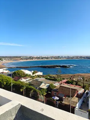 a view of the ocean from a building at L'Écume des Sablettes in Mansouria