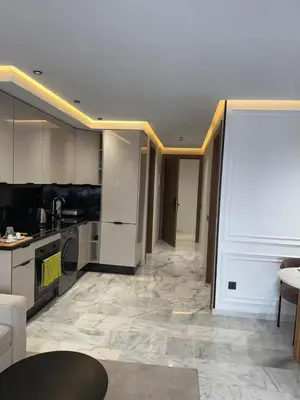 a room with a kitchen and a living room at Joli Studio with Seaview 16 in Casablanca