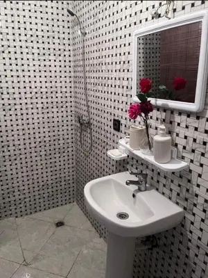 a white bathroom with a sink and a mirror at En face hôpital M6,Proche Aéroport et nearchore in Oulad Akkou