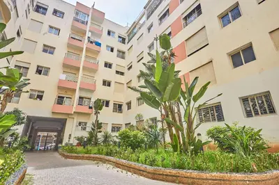 an apartment building with a courtyard with plants at 2BR Getaway Near and Seaside Promenade in Casablanca