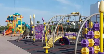 a childrens playground with slides and slidesktop at La perle de blanca beach in Sidi Rahal