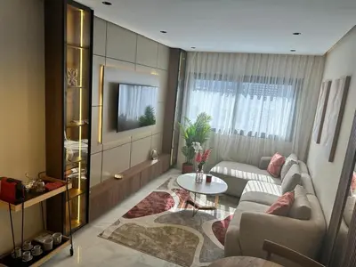 a living room with a couch and a table at Harmonie Elitaire in Casablanca