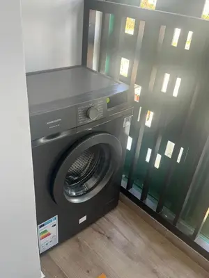a washing machine in a room next to a window at Appart idéal Face Gare Agdal in Rabat