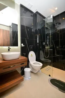 a bathroom with a toilet and a sink and a shower at Antonio Cerezo in Maarif