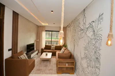 a living room with a couch and a tv at Antonio Cerezo in Maarif