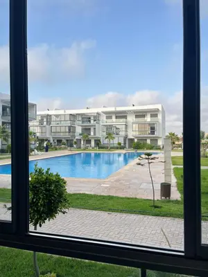 a view from a window of a building with a swimming pool at Appartement cosy et confortable in Casablanca