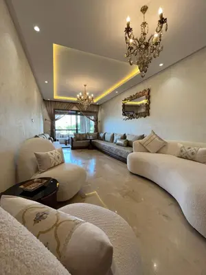 a large living room with couches and a chandelier at Appartement cosy et confortable in Casablanca