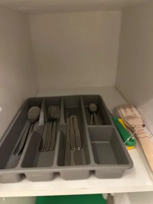 a kitchen sink with utensils on a shelf at Chic Studio In The Heart of Casablanca Morocco in Casablanca