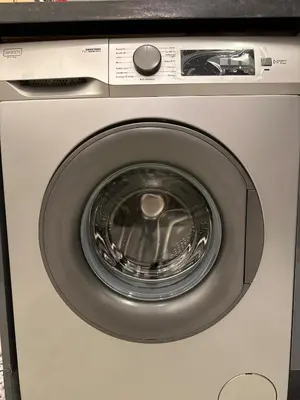 a washer and dryer with its door open at Chic Studio In The Heart of Casablanca Morocco in Casablanca
